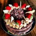 raw layered chocolate cake with strawberry and white chocolate thumbnail